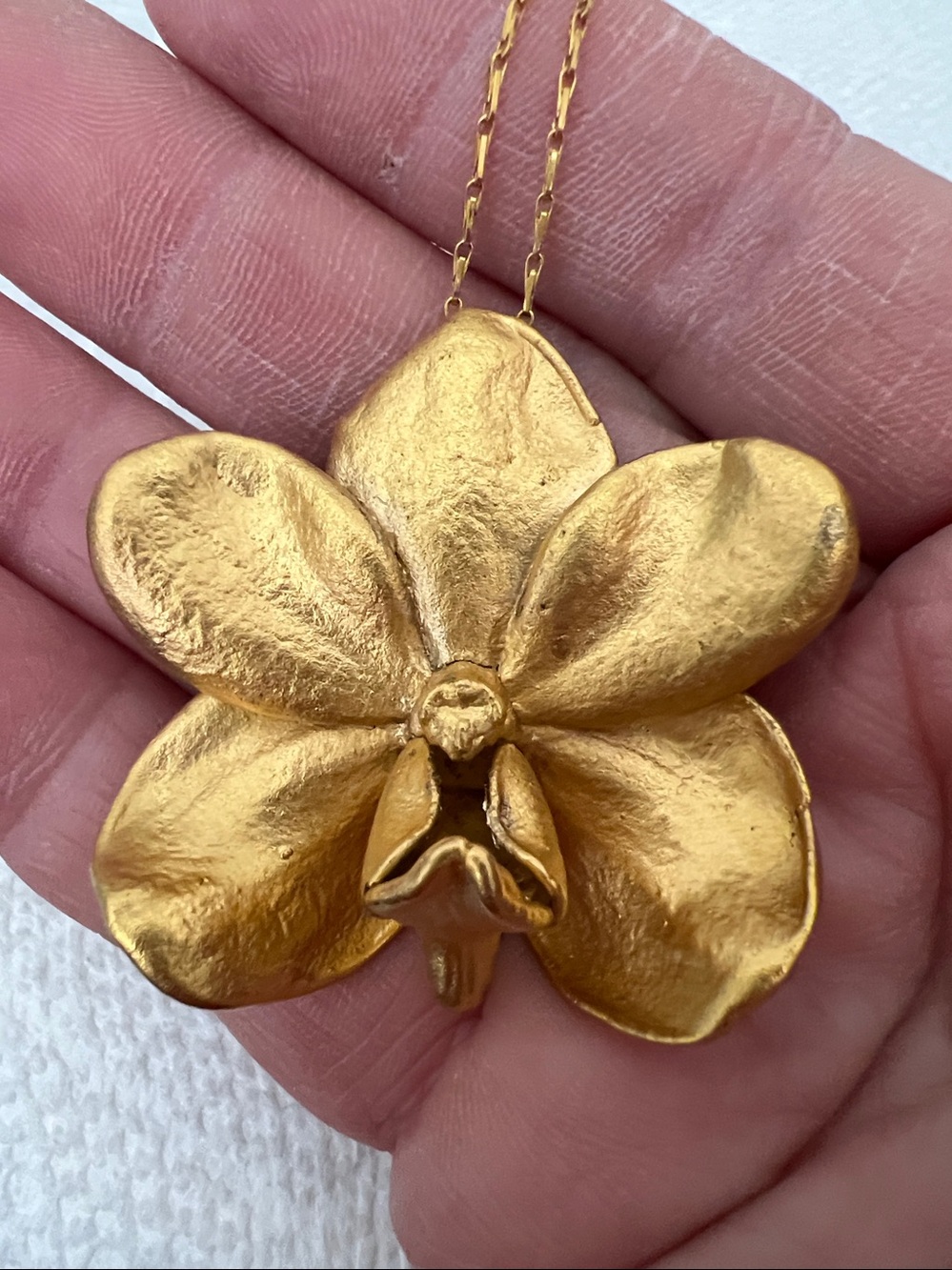 Risis Singapore Orchid 22Kt gold plated pendant necklace 16”